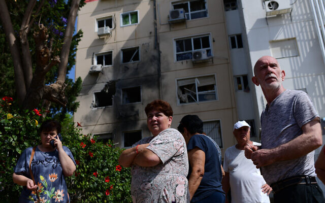 An apartment building hit by a rocket fired from the Gaza Strip in Ashkelon, southern Israel, on May 11, 2021. (Tomer Neuberg/Flash90) An apartment building hit by a rocket fired from the Gaza Strip in Ashkelon, southern Israel, on May 11, 2021. (Tomer Neuberg/Flash90)