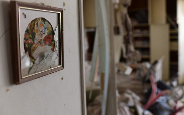 The scene where a rocket fired from the Gaza Strip hit a house in the southern Israeli city of Ashkelon on May 11, 2021. (Tomer Neuberg/Flash90) The scene where a rocket fired from the Gaza Strip hit a house in the southern Israeli city of Ashkelon on May 11, 2021. (Tomer Neuberg/Flash90)