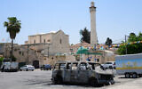 Torched synagogues, cars and vandalized stores in Lod, following a night of ethnic rioting in the mixed Jewish-Arab city in central Israel, May 12, 2021. (Avshalom Sassoni/Flash90)