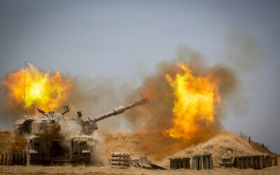 IDF Artillery Corps fires into Gaza, near the Israeli border on May 12, 2021, following heavy rocket and missile barrage fired into Israel by terrorists in Gaza. (Yonatan Sindel/Flash90)