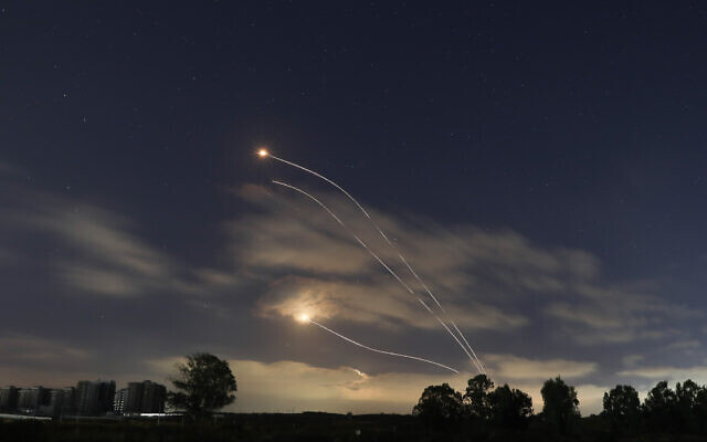 A long exposure picture shows Iron Dome interception missiles fired as rockets are launched from the Gaza Strip to Israel, May 13, 2021. (Noam Revkin Fenton/Flash90)