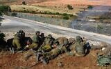 Ilustrative: Israeli soldiers guard in Metula, on the border between Israel and Lebanon, northern Israel, on May 14, 2021, after Lebanese protesters crossed the Israeli border fence. (Basel Awidat/Flash90)