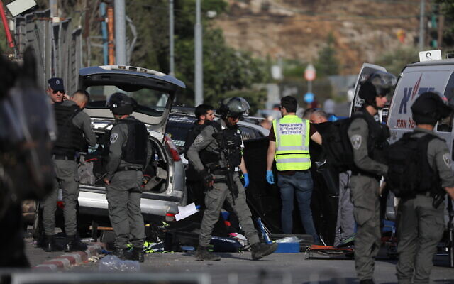 Police at the scene of a car ramming attack in the Sheikh Jarrah neighborhood of East Jerusalem, on May 16, 2021. (Yonatan Sindel/FLASH90) Police at the scene of a car ramming attack in the Sheikh Jarrah neighborhood of East Jerusalem, on May 16, 2021. (Yonatan Sindel/FLASH90)
