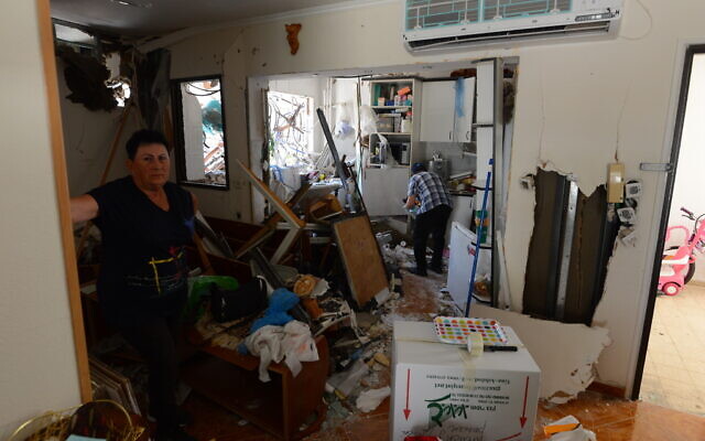 Malka Stilerman (L) in her home hit by a rocket fired from the Gaza Strip, in Ashdod, on May 18, 2021 (Avi Roccah/Flash90) Malka Stilerman (L) in her home hit by a rocket fired from the Gaza Strip, in Ashdod, on May 18, 2021 (Avi Roccah/Flash90)