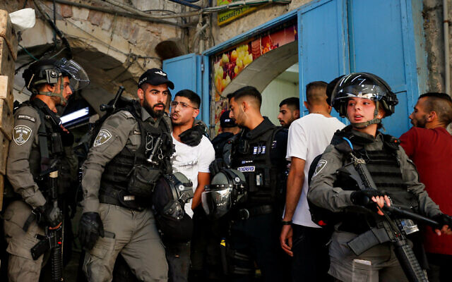 Illustrative: Israeli police officers seen during clashes with protesters in Jerusalem's Old City, May 18, 2021. (Jamal Awad/Flash90) Illustrative: Israeli police officers seen during clashes with protesters in Jerusalem's Old City, May 18, 2021. (Jamal Awad/Flash90)