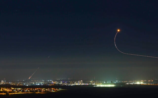 Rockets fired by Hamas terrorists in Gaza into Israel, seen over the central Israeli town of Kiryat Gat on May 18, 2021. (Nati Shohat/Flash90)