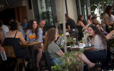 Israelis on the streets of Tel Aviv, May 23, 2021. (Miriam Alster/FLASH90)