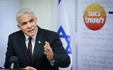 Yesh Atid party chief Yair Lapid leads a faction meeting at the Knesset on May 24, 2021. (Olivier Fitoussi/Flash90)