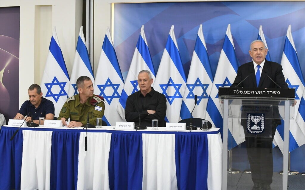From left: Shin Bet chief Nadav Argaman, IDF chief Aviv Kohavi, Defense Minister Benny Gantz and Prime Minister Benjamin Netanyahu, at a press conference after the Gaza ceasefire, Tel Aviv, May 21, 2021. (Amos Ben Gershom/GPO)