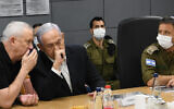 Defense Minister Benny Gantz and Prime Minister Benjamin Netanyahu during a consultation amid Hamas rocket fire at Israel and IDF counterstrikes, May 11, 2021. (Amos Ben Gershom / GPO)