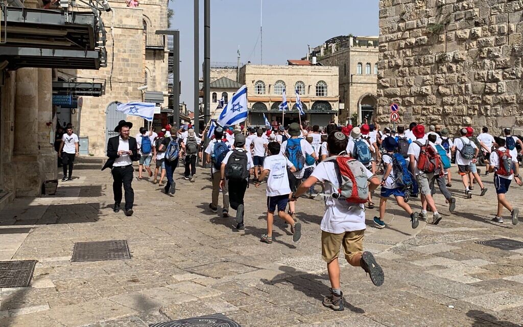 Israelis stream into Jerusalem's Old City through the Jaffa Gate during the annual flag march on May 10, 2021 (Sarah Tuttle-Singer/Times of Israel)