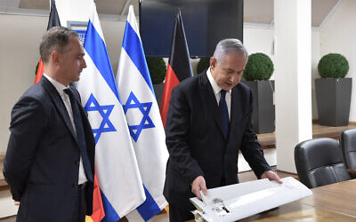 Prime Minister Benjamin Netanyahu, right, shows visiting German Foreign Minister Heiko Maas fragments of a drone that Israel says was launched by Iran toward northern Israel, which was brought down by the Israeli military, on May 20, 2021. (Kobi Gideon/Government Press Office)