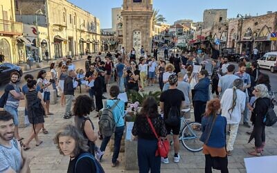 Demonstrators gather to display coexistence at the Jaffa clock tower square, May 13, 2021. (Elie Bleier)