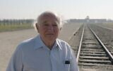 Roman Kent stands outside Auschwitz. (Courtesy of Jewish Foundation for the Righteous via JTA)