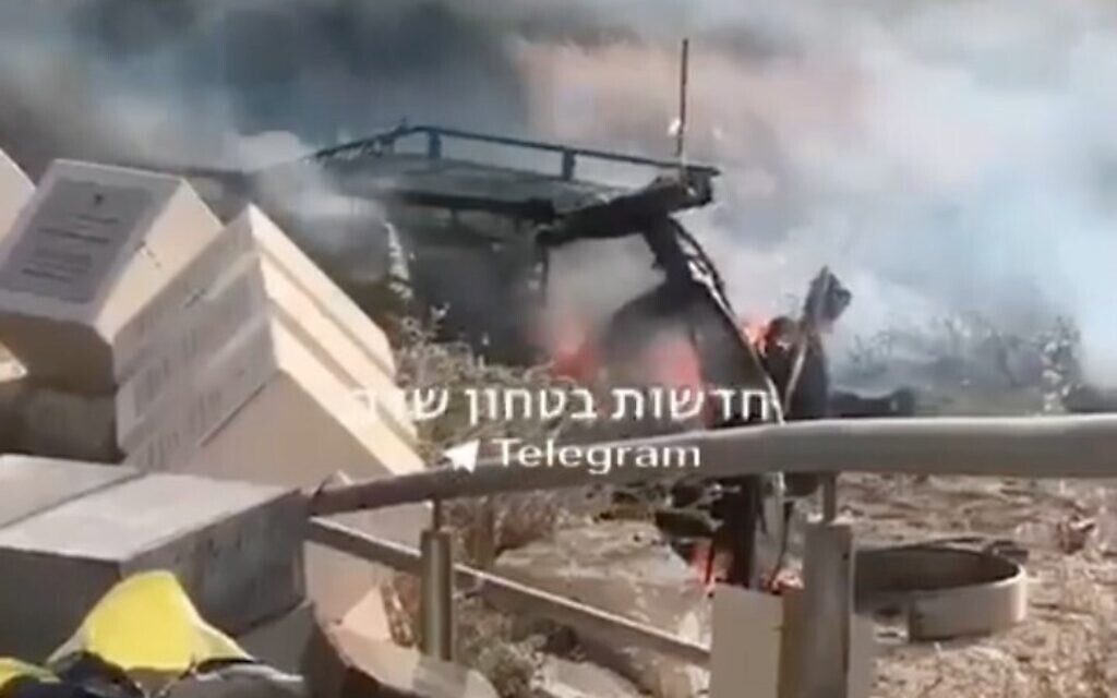 An Israeli car on fire near the Gaza border after being hit by a rocket fired from the Gaza Strip, May 10, 2021 (Facebook screenshot)