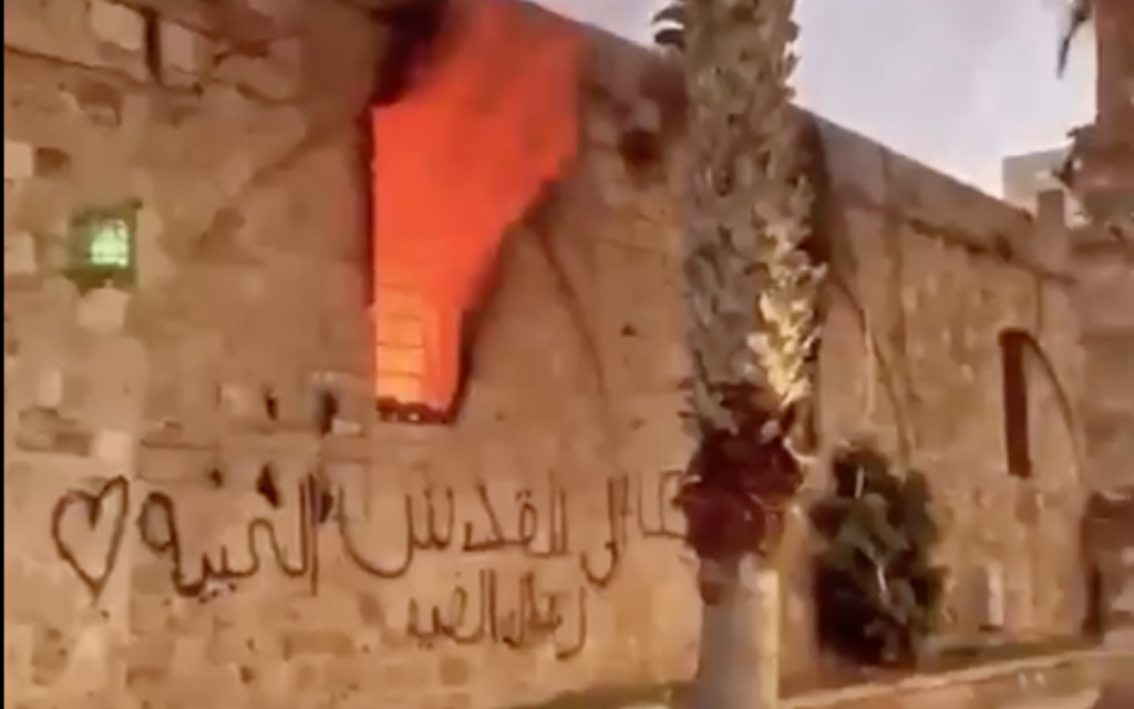 A fire at a theater in Acre started by Arab rioters on May 14, 2021. (Screen capture/Twitter)