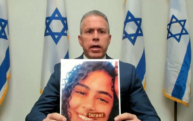 Israeli UN envoy Gilad Erdan holding up a picture of Nadin Awad, who was killed by a Hamas rocket, at a UN Security Council virtual meeting on May 16, 2021. (screen capture: UN TV) Israeli UN envoy Gilad Erdan holding up a picture of Nadin Awad, who was killed by a Hamas rocket, at a UN Security Council virtual meeting on May 16, 2021. (screen capture: UN TV)
