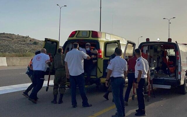 Medics load victims of an apparent drive-by shooting attack in the northern West Bank onto an ambulance on May 2, 2021. (Magen David Adom) Medics load victims of an apparent drive-by shooting attack in the northern West Bank onto an ambulance on May 2, 2021. (Magen David Adom)
