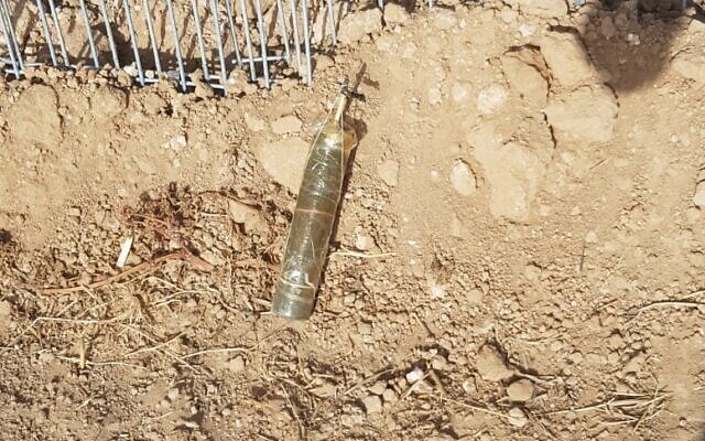 A suspected explosive device that was apparently flown into southern Israel with a balloon from the Gaza Strip lands in a field in the community of Kfar Aza on May 3, 2021. (Sha'ar Hanegev region) A suspected explosive device that was apparently flown into southern Israel with a balloon from the Gaza Strip lands in a field in the community of Kfar Aza on May 3, 2021. (Sha'ar Hanegev region)