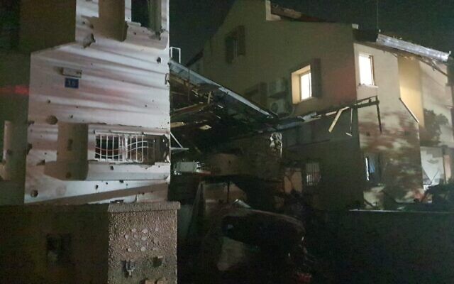 A house that was hit by shrapnel from a rocket strike in the city of Rishon Lezion in central Israel, which also killed a woman, on May 11, 2021. (Israel Police)