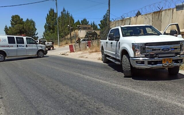 Soldiers stand by the scene of the suspected car-ramming and stabbing attack near a military post near Ofra in the West Bank on May 14, 2021. (Courtesy / Ofra Youth) Soldiers stand by the scene of the suspected car-ramming and stabbing attack near a military post near Ofra in the West Bank on May 14, 2021. (Courtesy / Ofra Youth)
