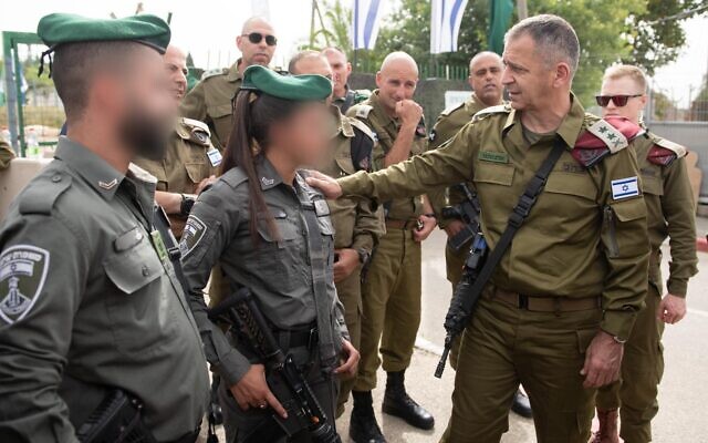 IDF Chief fo Staff Aviv Kohavi, right, meets with Border Police officers who responded to a shooting attack in the West Bank two days prior, on May 9, 2021. (Israel Defense Forces) IDF Chief fo Staff Aviv Kohavi, right, meets with Border Police officers who responded to a shooting attack in the West Bank two days prior, on May 9, 2021. (Israel Defense Forces)
