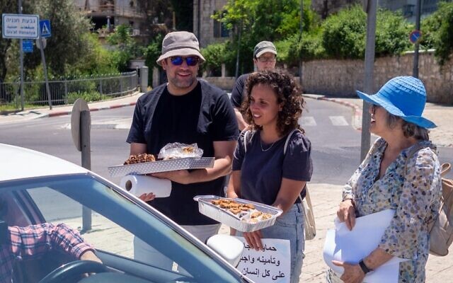 In the spirit of coexistence, Jewish residents of Abu Tor, Jerusalem, hand out cake, sweets and good wishes to their Arab neighbors during the Muslim holiday of Eid al-Fitr at the end of Ramadan, May 15, 2021 (Good Neighbors).