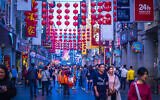 Guangzhou, China, December 2019. The Shangxiajiu pedestrian street in Liwan District, a main shopping district of the city and a major tourist attraction (Parichart Thongmee; iStock by Getty Images).