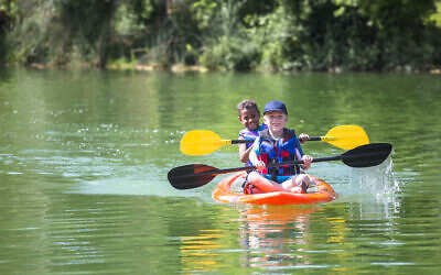 Illustrative: Two boys kayaking down a river at summer camp (Yobro10; iStock by Getty Images) Illustrative: Two boys kayaking down a river at summer camp (Yobro10; iStock by Getty Images)
