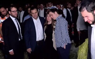 The parents of Donny Morris, killed in the Meron disaster, attend his funeral in Jerusalem, May 2, 2021 (Screen grab)