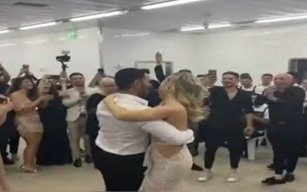 Guests dance in the bomb shelter as Loren and David's wedding is interrupted by rocket fire, May 19, 2021 (Screen grab, Channel 12)