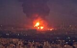 A picture taken on June 2, 2021, shows smoke billowing from the site of a refinery fire in the Iranian capital Tehran. (ATTA KENARE / AFP)