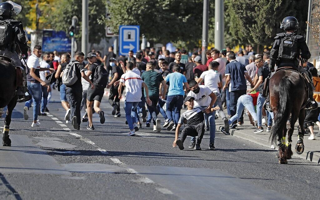 Israeli security forces disperse Palestinians near the Damascus gate in east Jerusalem, on June 15, 2021. (Ahmad GHARABLI / AFP)
