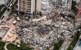 This aerial view, shows search and rescue personnel working on site after the partial collapse of the Champlain Towers South in Surfside, north of Miami Beach, on June 24, 2021. CHANDAN KHANNA / AFP)