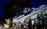 Search and Rescue personnel work at a partial collapse building in Surfside, Miami Beach, on June 24, 2021. (CHANDAN KHANNA / AFP)