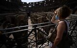 A visitor looks at the underground area inside the Colosseum in Rome on June 25, 2021 (Filippo MONTEFORTE / AFP)