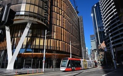 A tram commutes on a street in Sydney on June 26, 2021, after authorities locked down several central areas of Australia's largest city to contain an outbreak of the highly contagious Delta variant. (SAEED KHAN / AFP)