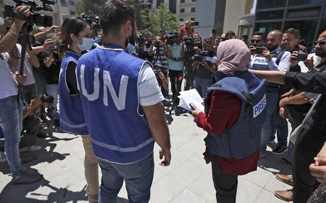Journalists protest outside the United Nations office in the West Bank city of Ramallah on June 28, 2021, demanding protection following attacks by Palestinian Authority security forces on their colleagues. (Photo by ABBAS MOMANI / AFP)