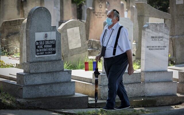 A member of the Jewish community walks at the Jewish cemetery in the city of Iasi, Romania, on June 29, 2021. (Liviu Chirica/AFP) A member of the Jewish community walks at the Jewish cemetery in the city of Iasi, Romania, on June 29, 2021. (Liviu Chirica/AFP)