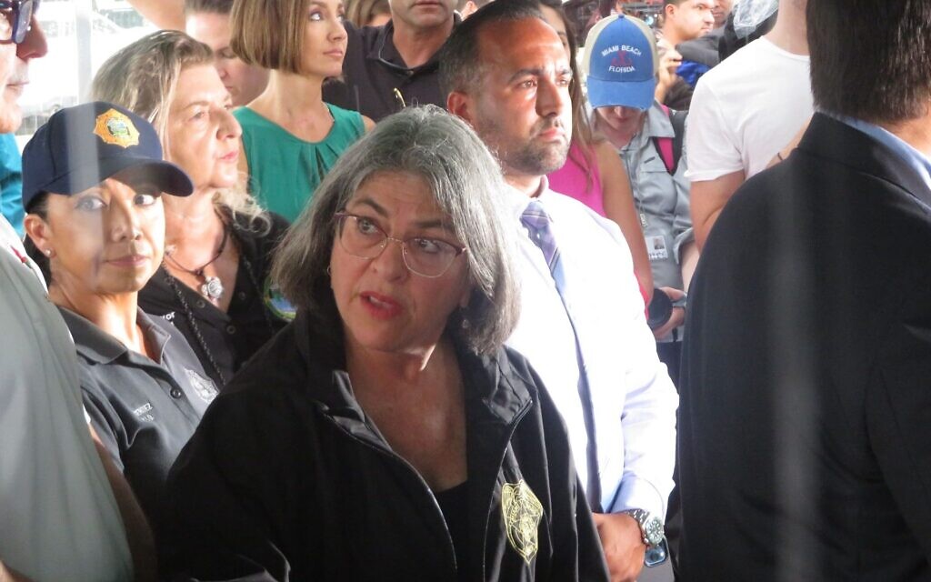 Miami-Dade County Mayor Daniella Levine Cava consults with aides during a news conference at the site of the building collapse in Surfside, Florida, June 28, 2021. (Ron Kampeas/JTA) Miami-Dade County Mayor Daniella Levine Cava consults with aides during a news conference at the site of the building collapse in Surfside, Florida, June 28, 2021. (Ron Kampeas/JTA)