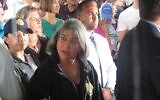 Miami-Dade County Mayor Daniella Levine Cava consults with aides during a news conference at the site of the building collapse in Surfside, Florida, June 28, 2021. (Ron Kampeas/JTA)