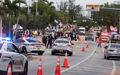 Police investigate the scene where a pickup truck drove into a crowd of people at a Pride parade on June 19, 2021 in Wilton Manors, Florida. (Jason Koerner/Getty Images/AFP)