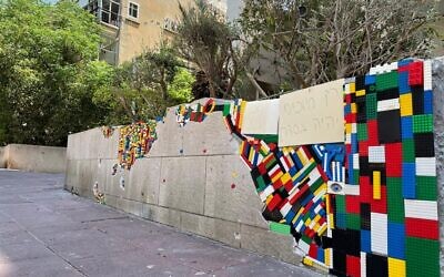 Legos used to repair a wall struck by a Gaza rocket in Ramat Gan on May 15, 2021. (Raz Sror)