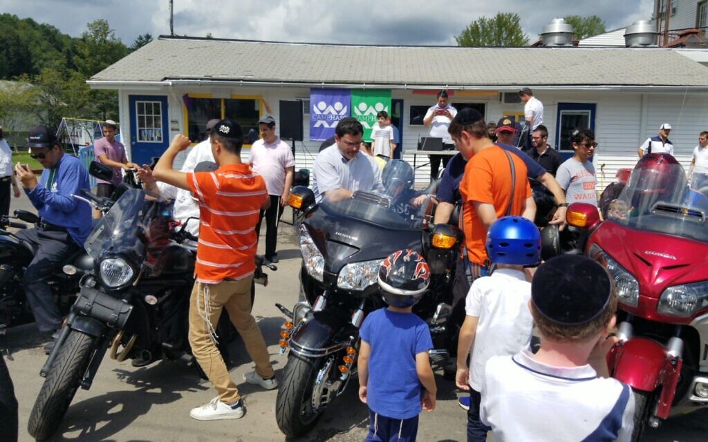 Members of the Chai Riders motorcycle club visit Camp HASC for developmentally disabled children. (Courtesy Lauren Secular)