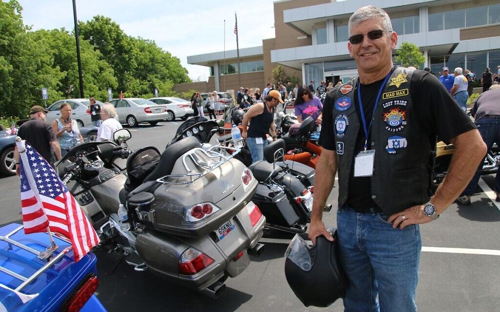 A member of the Lost Tribe motorcycle club displays badges espousing Jewish pride and Holocaust remembrance. (Courtesy Jewish Motorcycle Alliance)