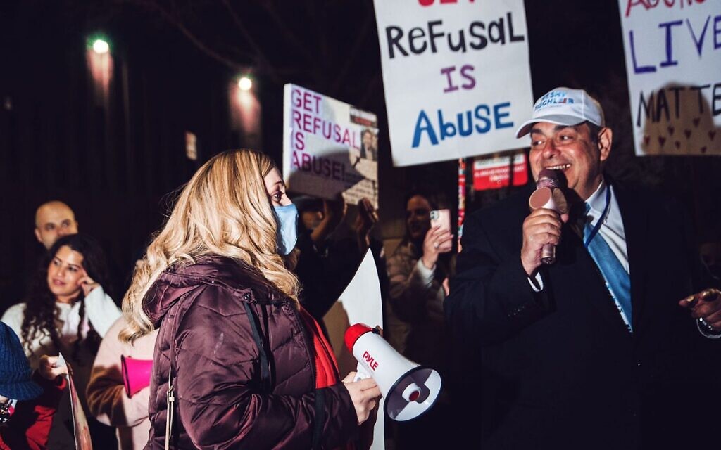 People at a rally call to free a woman whose husband refused to grant her a Jewish divorce, Brooklyn, March 21, 2021. (Anna Rathkopf/ via JTA)