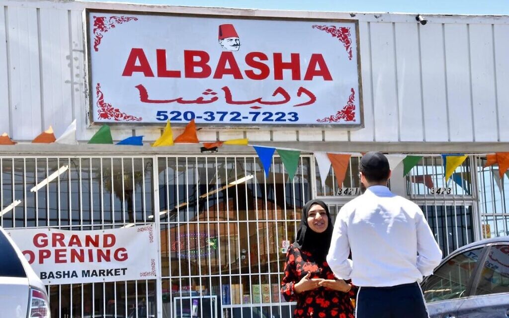 Ghufran Almusawi, proprietor of Al Basha Grocery in Tucson, Arizona, speaks with a Jewish customer. Her store sells both kosher and halal products in an effort to create a 'melting pot' for Jews and Muslims. (Michael Zaccaria/Keeping Jewish/ via JTA) Ghufran Almusawi, proprietor of Al Basha Grocery in Tucson, Arizona, speaks with a Jewish customer. Her store sells both kosher and halal products in an effort to create a 'melting pot' for Jews and Muslims. (Michael Zaccaria/Keeping Jewish/ via JTA)