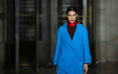 The Oscar De la Renta collection is modeled by Bella Hadid during Fashion Week, Monday, Feb. 10, 2020, in New York. (AP Photo/Eduardo Munoz Alvarez)