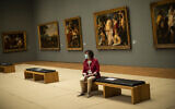 Illustrative: A woman wears a face mask, to prevent against the spread of coronavirus, at the Royal Museum of Fine Arts in Brussels, May 19, 2020. (AP Photo/Francisco Seco, File)