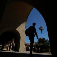 In this April 9, 2019, photo, pedestrians walk on the campus at Stanford University in Stanford, California (AP Photo/Jeff Chiu, File)